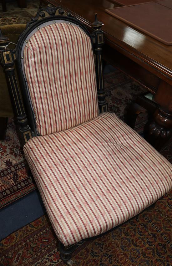 A late Victorian ebonised nursing chair